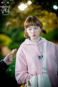 Weightlifting Fairy Kim Bok Joo wearing a Pink Hoodie